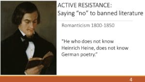 A man holding a book in his hands.