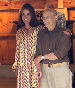 Woman and man posing together.